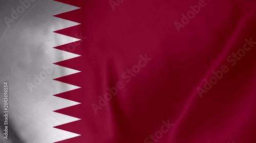 Waving flag of Qatar with detailed texture and fabric folds in crimson and white colors
