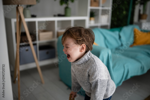 Slika na platnu Toddler having tantrum crying loudly upset indoors