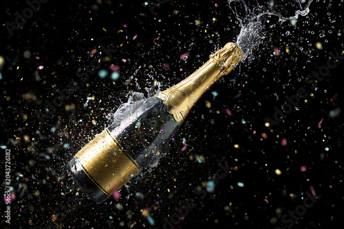 Celebrate success with a champagne bottle explosion, a symbol of luxury, and achievement, for celebrations, parties, and festive occasions