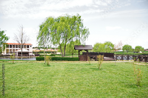 Historical park in Neofit Rilski, Bulgaria, overlooking a large lake with fences and passages, symbolically connecting the different eras of our lands 