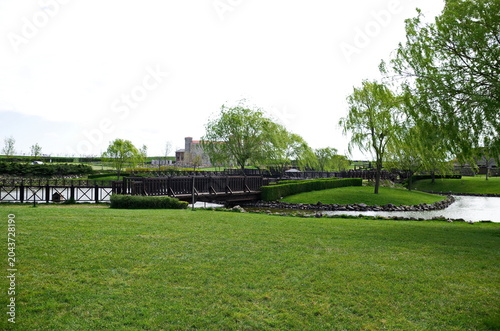 Historical park in Neofit Rilski, Bulgaria, overlooking a large lake with fences and passages, symbolically connecting the different eras of our lands 