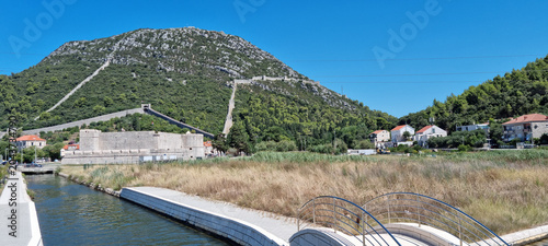 Bild auf Leinwand Ancient stone defensive walls and fortification complex built on a steep mountai