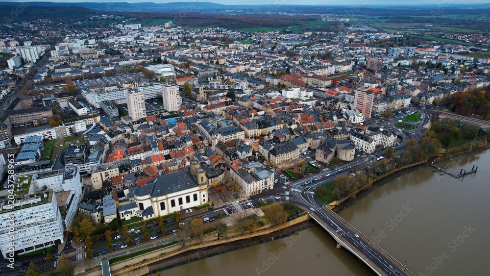 Obraz premium An panoramic aerial view of the old town city Thionville in France on a cloudy noon in autumn.. 