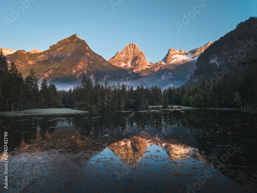 Schiederweiher lake with mountain reflections at sunrise in Upper Austria, Austria
