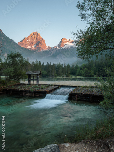 Schiederweiher lake with mountain reflections at sunrise in Upper Austria, Austria