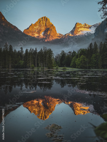 Schiederweiher lake with mountain reflections at sunrise in Upper Austria, Austria