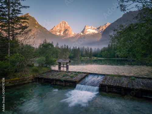 Schiederweiher lake with mountain reflections at sunrise in Upper Austria, Austria