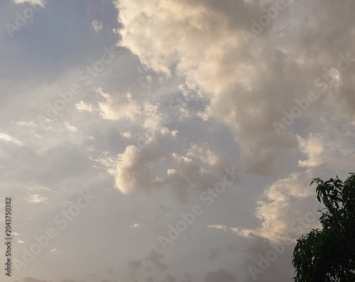 sunset in the cloudy sky, sunlight through clouds background, nature photography, natural wallpaper 