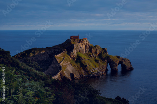 The San Juan de Gaztelugatxe Natural Monument is located on the Basque coast, between the municipalities of Bakio and Bermeo, at dawn