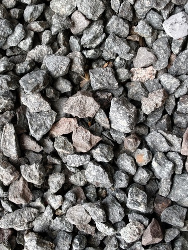 Crushed gray and beige gravel stones filling the frame