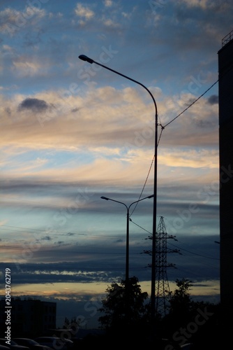Lantern against the backdrop of a beautiful evening sky cityscape city sunset