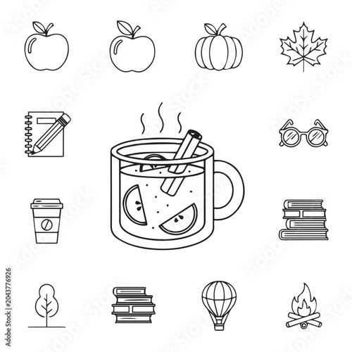 Cozy autumn elements including hot spiced cider and books arranged in a grid for seasonal themes