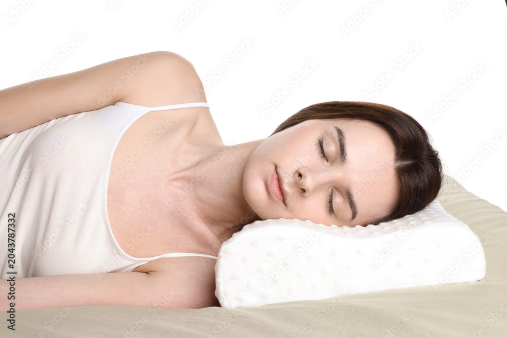 Obraz premium Woman sleeping on bed with orthopedic pillow against white background