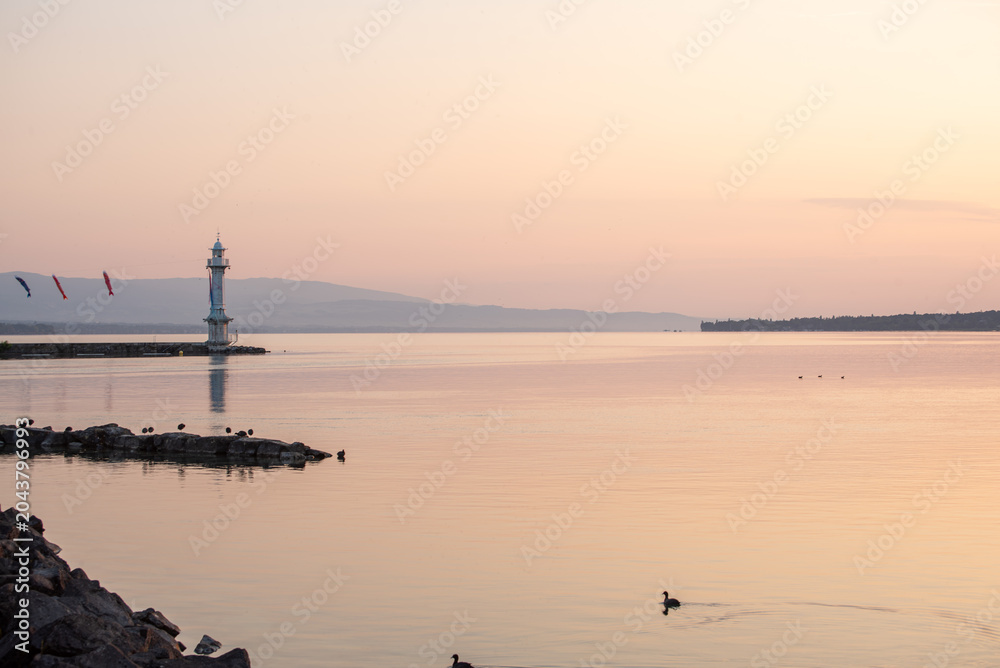 Fototapeta premium sunset over the harbor of lake Geneva