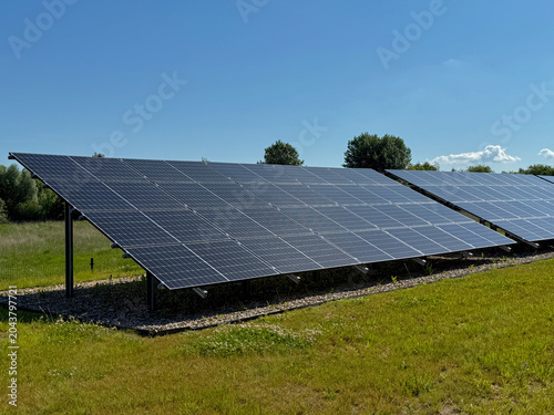 Modern Solar Power Plant on a Green Field, Renewable Clean Energy Production