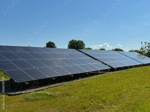 Modern Solar Power Plant on a Green Field, Renewable Clean Energy Production