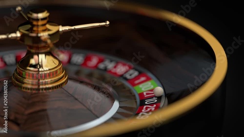 Casino Roulette Wheel Spinning and Ball in Flight with Selective Focus, Close-up