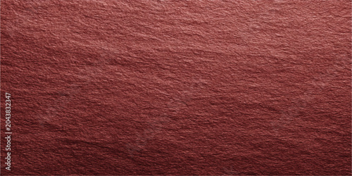 Photos texture of a dark red slate surface, showing its natural grain and rough, uneven texture, suitable for background or design element