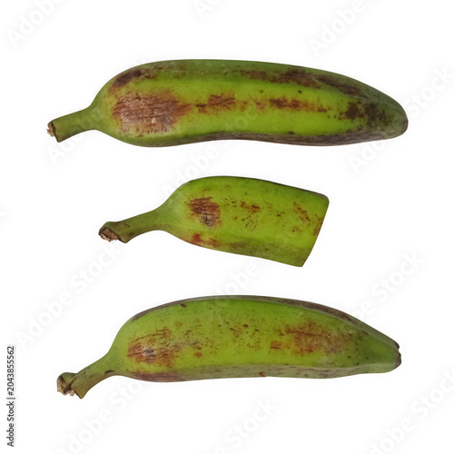 Vászonkép Three ripe green plantains with brown spots isolated on a simple plain surface f