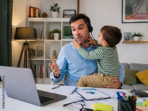 Obraz na płótnie Child interrupting remote work video call at home