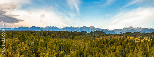 Panoramic views of the Southern Alps and rain forest from the tree walk suspension bridge at Hokitika NZ