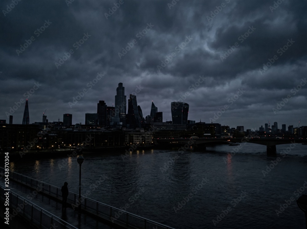 Fototapeta premium Dark megacity skyline during nighttime power outage