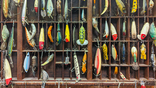 Bild auf Leinwand Collection of vintage fishing lures displayed in an antique shadow box