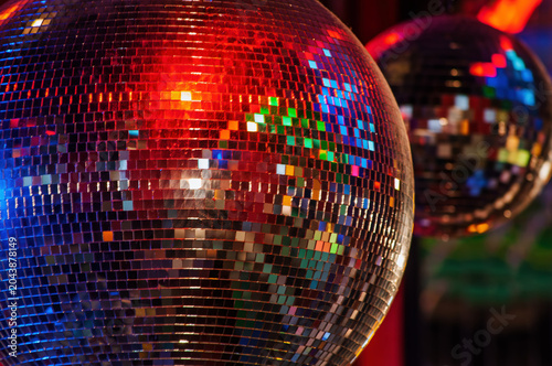 Disco Balls Reflecting Colorful Lights at a Party