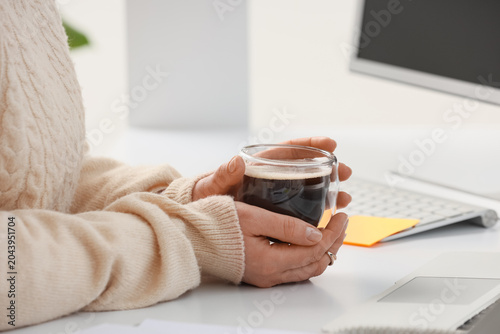 Young woman with cup of cof...