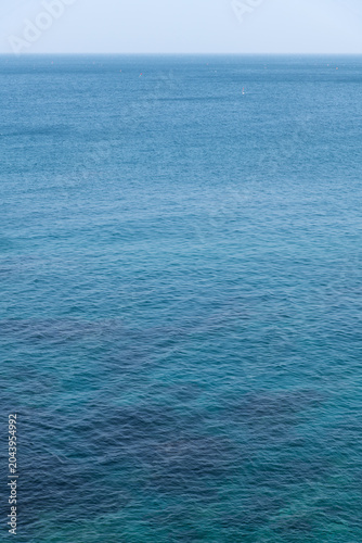 Vertical shot of deep blue ocean water gradient