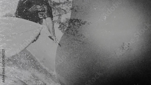 Black and white photo of professional surfer with grunge texture. A Man Surfing a Wave Background.