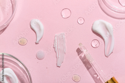 Petri dishes with different samples, pipette and professional glassware on pi...