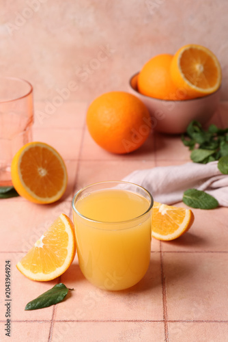 Glass of tasty juice with o...