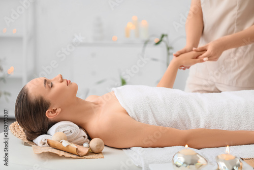 Physiotherapist giving hand...