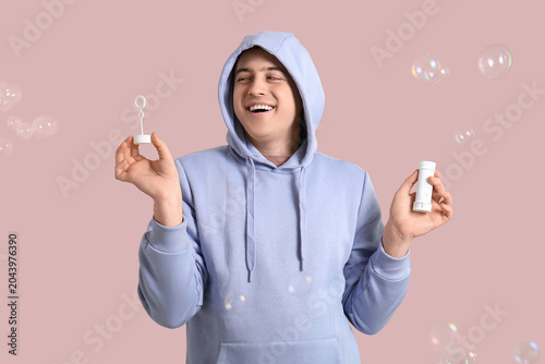 Young happy man in hoodie p...