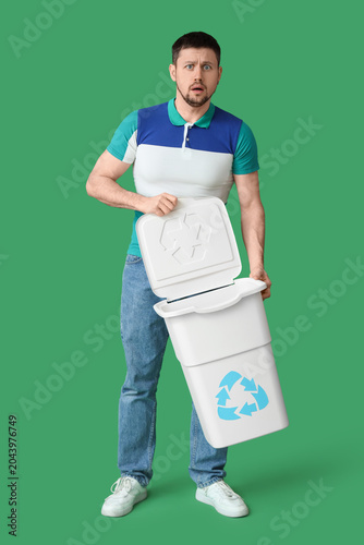 Confused young man holding ...
