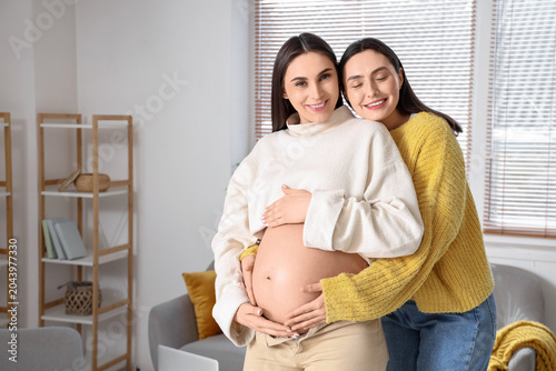 Young pregnant lesbian coup...