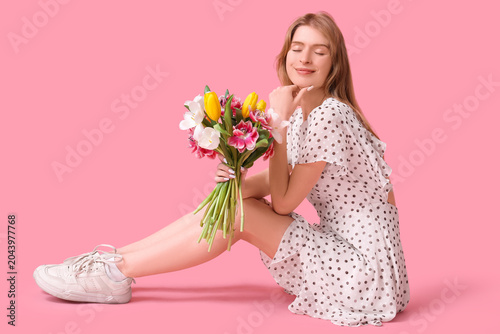 Pretty young woman with bou...