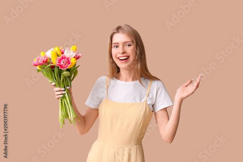 Happy young woman with bouq...