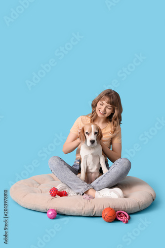 Young woman stroking cute b...
