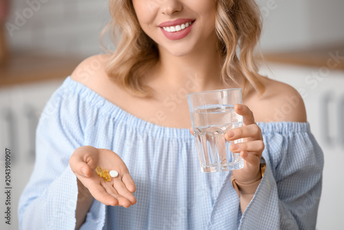 Young woman with glass of w...