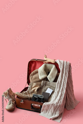 Suitcase with warm clothes,...