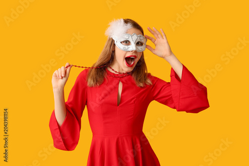 Shocked young woman in whit...