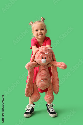Cute little girl with toy b...