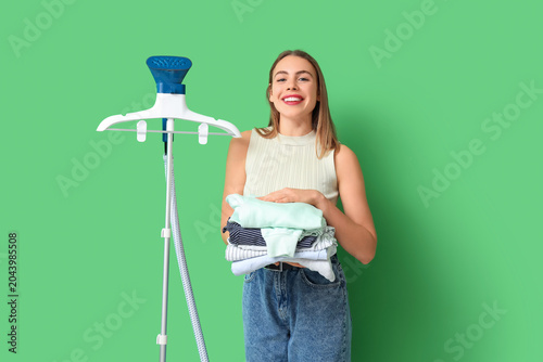 Smiling young woman holding...