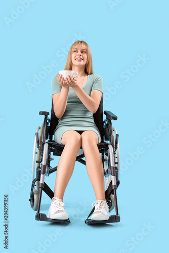 Young woman with cup of tea...