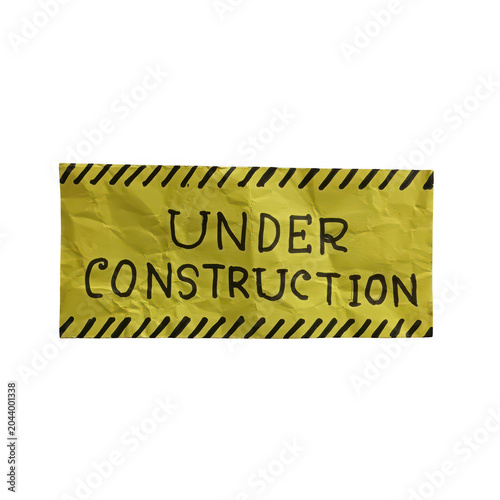 Yellow under construction sign with warning text
