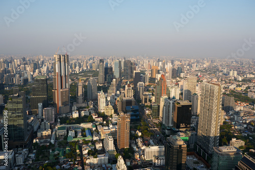 Stunning daytime aerial view of dense urban sprawl and architectural design of modern skyscrapers in the business district of Bangkok Thailand