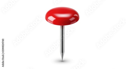 A shiny red pushpin with a silver metal point on a white background