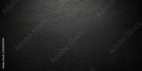 Foto Dark charcoal texture with subtle grain and a slight vignette effect, creating a sophisticated and minimalist backdrop